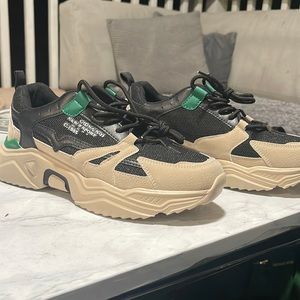 Tan and black sneakers